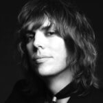 Listen to The Struts frontman Luke Spiller's "stripped-back" and mournful take on Slade's 'Merry Xmas Everybody'