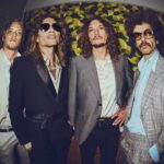 The Darkness "reimagine" Christmas classic 'Mistletoe And Wine' with "a few sprinkles of shoegaze and drone"