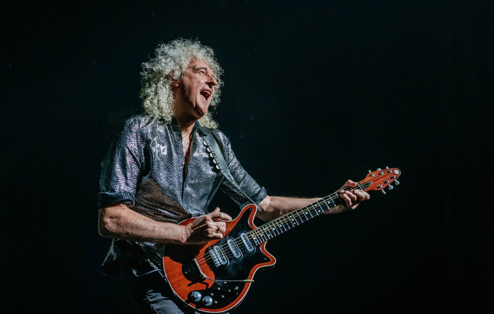 Brian May says Queen won't be playing Glastonbury because of "politics": "They like killing badgers"