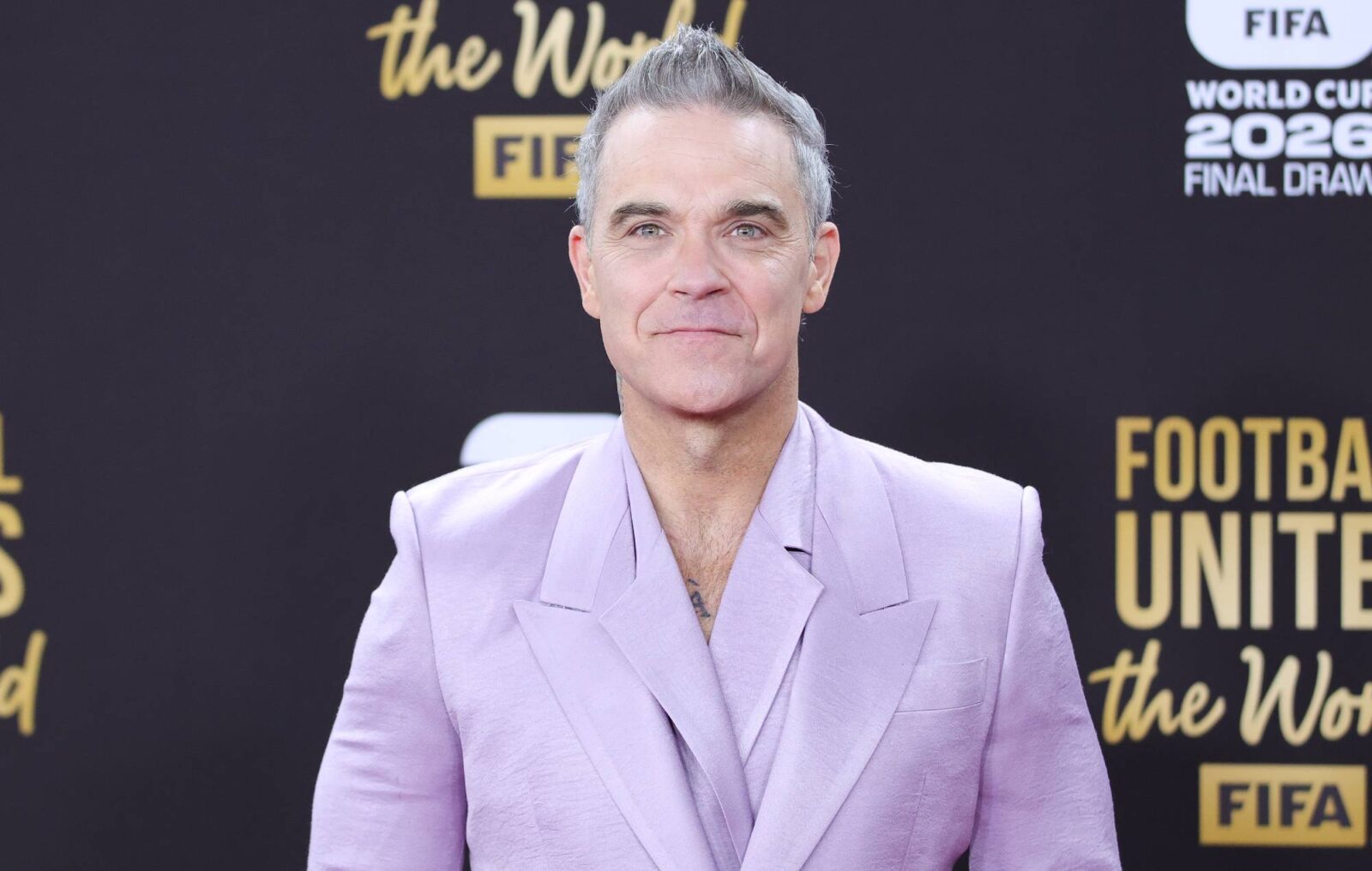 Robbie Williams says he's "Bruce Wayne in Los Angeles and Batman everywhere else”