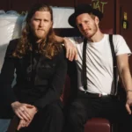 The Lumineers' Wesley Schultz On Touring Australia, Grief, And Setting A Folk Rock Trend