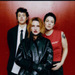 MUNA celebrate their best with "powerful and euphoric" comeback single 'Dancing On The Wall' and announce new album and intimate shows