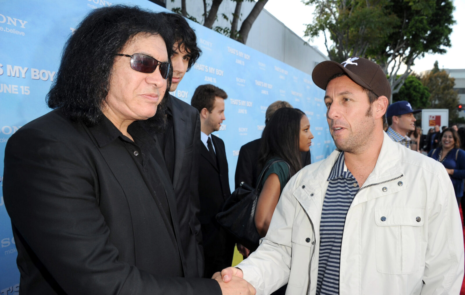 Gene Simmons stuck tongue down Adam Sandler's throat at party to turn him "into my bitch"