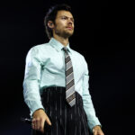 Harry Styles crashes Ryan Gosling's 'SNL' monologue ahead of hosting next week: "It's been a while"