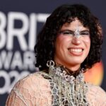 Jacob Alon raises Palestine scarf during Sharon Osbourne's speech at 2026 BRIT Awards