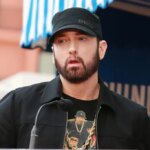 Eminem Is 'Not Homophobic,' Says John Waters, Citing Elton John Gift