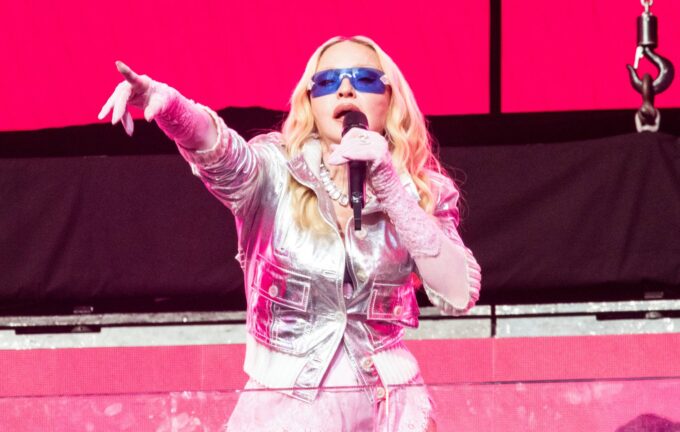 Madonna urges fans to "put your fucking phones down and connect" after returning to the stage